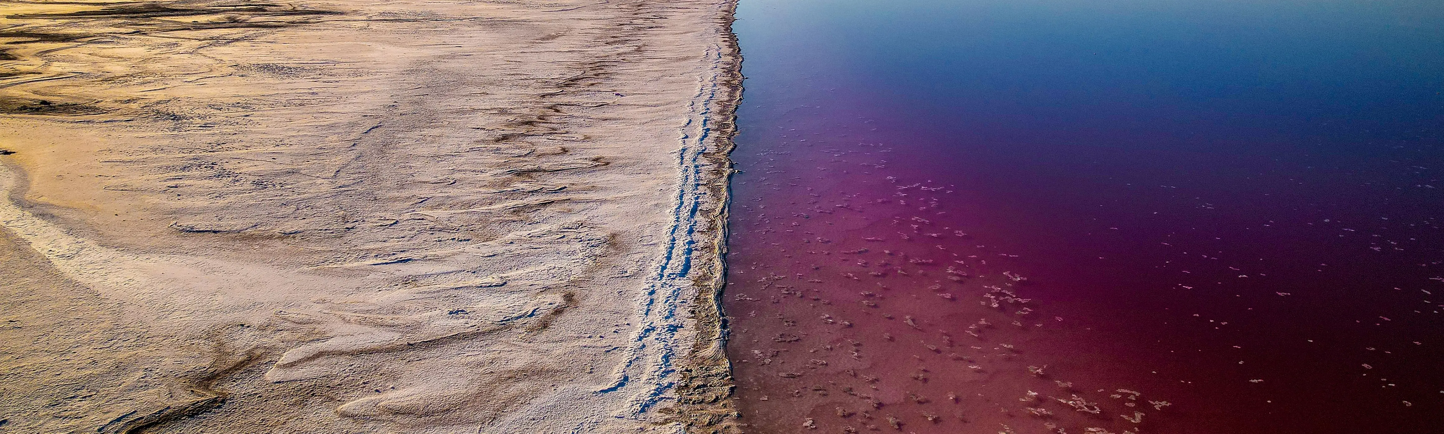 Aerial view of the Great Salt Lake shoreline and mineral-rich water